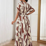 Printed waist cinching dress