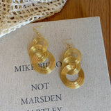 Gold Multi - Layered Circular Hollow Statement Drop Earrings